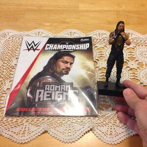 WWE Wrestling Roman Reigns action figure and collector's magazine